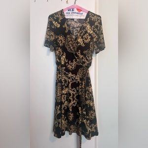 Midi dress size 14 but fits like a 12. Faux wrap style with gold print.